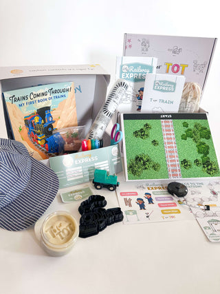 T is for Train Kit includes a book, activities, and accessories for hands-on learning and creativity.