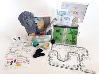 T is for Train Kit featuring a train hat, play materials, activity guides, and tracks for hands-on learning activities.