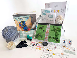 T is for Train Kit with toys, books, and educational materials promoting hands-on learning and creativity.