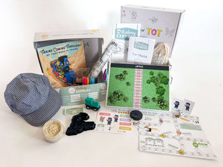 T is for Train Kit contents including a train hat, learning materials, toys, and an activity booklet for kids.