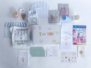 Flat lay of Ice Cream Scientist Kit featuring fun science materials, activity cards, and ice cream-themed items.