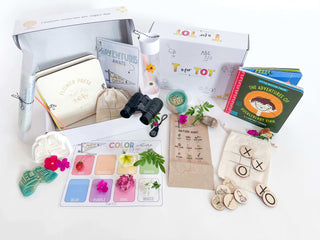Nature exploration kit for kids with binoculars, compass, homemade playdough, playdough cutter, flower press, and lantern craft. Includes nature walk bag, camping bag with tic-tac-toe and storytelling coins,