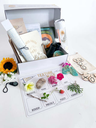 Complete backyard adventure kit for kids with binoculars, compass, flower press, homemade playdough, playdough cutter, lantern craft, camping bag with tic-tac-toe, and a