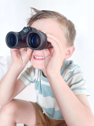 Outdoor play and camping kit for kids with homemade playdough, binoculars, compass, flower press, lantern craft, and a