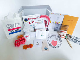 Learn and Play Kit monthly subscription box with educational toys, games, and activity sheets for young children.