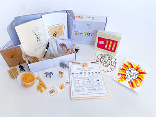 Play and learn zoo kit for kids with a giraffe playdough cutter, homemade playdough, zoo map, vet folder, and a