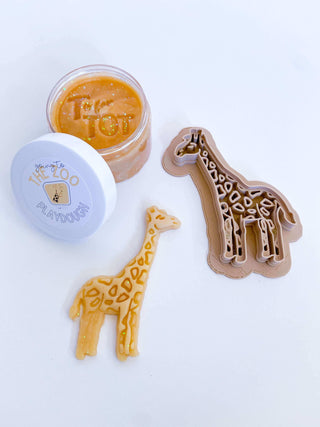 Homemade non-toxic playdough with giraffe cutter. Early childhood education enhancing fine motor skills.