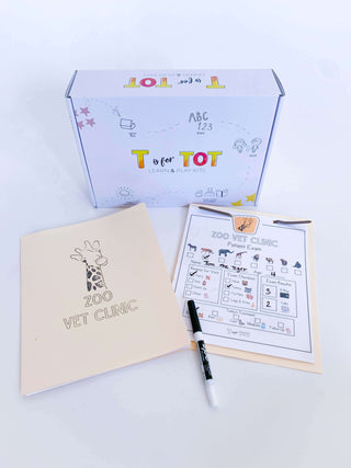Zoo adventure kit for kids with a zoo map, giraffe playdough cutter, homemade playdough, and a vet folder with handwriting practice sheets. Comes with play animals,
