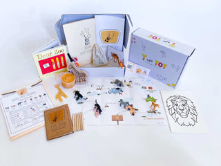 Zoo-themed learning kit for kids with a zoo map, homemade playdough, giraffe playdough cutter, and a vet folder with expo marker. Features play animals, zoo sketch journal, and a