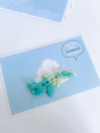 Airplane-themed play kit with everything needed for a day of pretend play at the airport. Comes with airplane playdough cutter, homemade playdough, airplane tickets, passport with stamps, pilot license, and a children