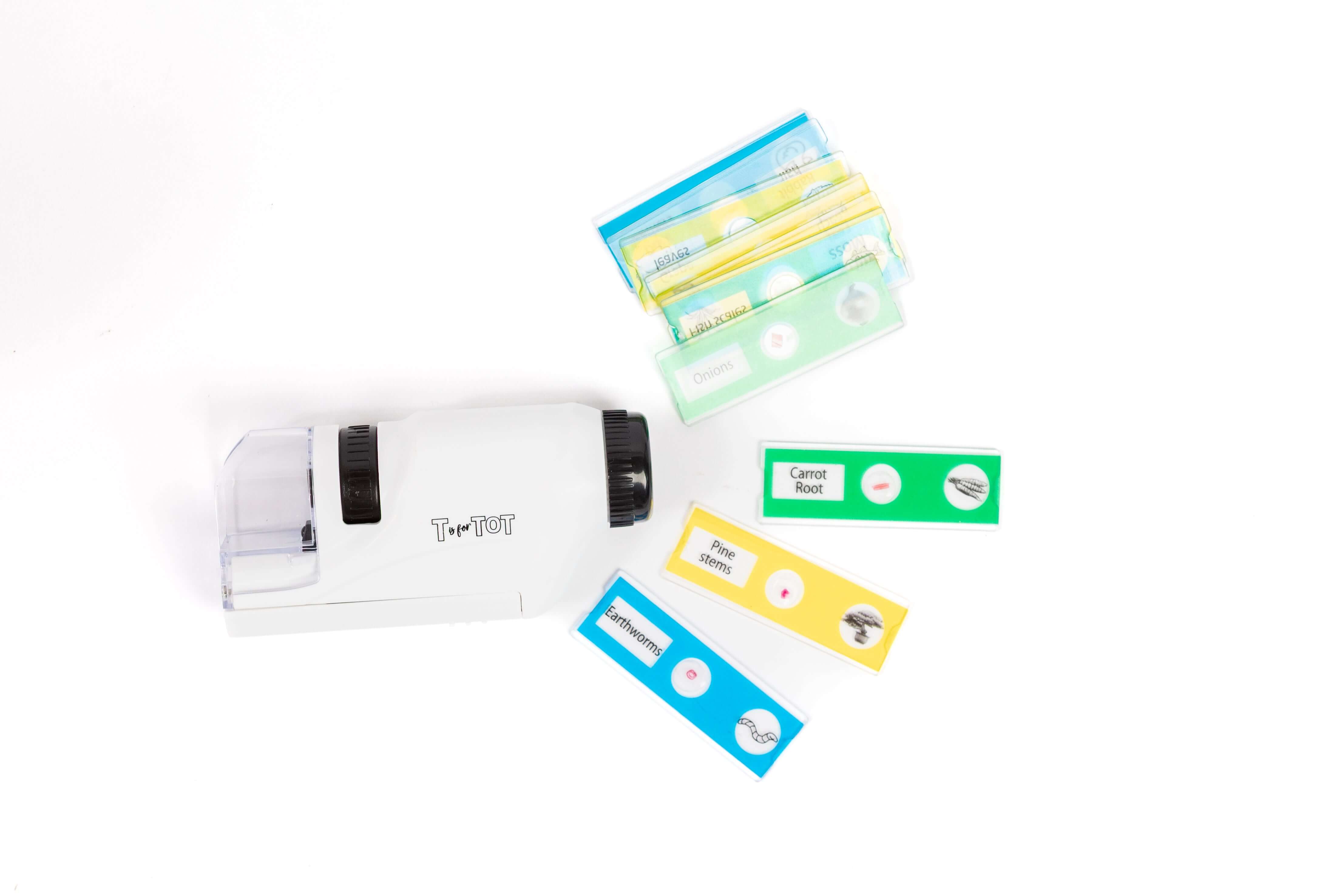 Close-up of a child-safe microscope with prepared specimen slides and exploration tools