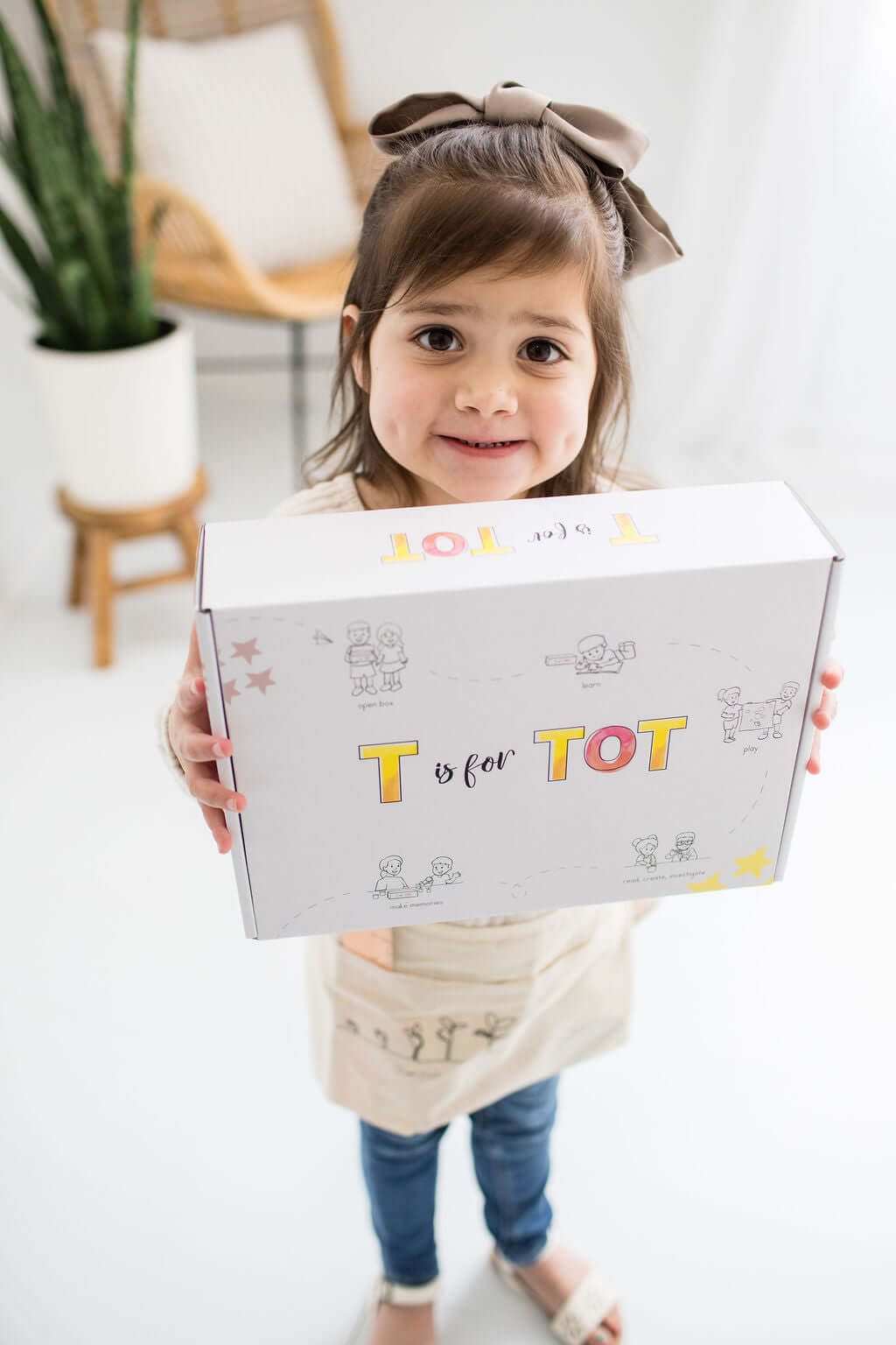 Child enjoying their T is for Tot learning kit at home