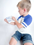 Community Helpers kit for children with dental x-rays, fire engine playdough cutter, homemade playdough, pretend dental activities, mailbag with letters, and community helper job cards for role-playing and imaginative play.